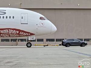 Watch as a Boeing 787 Dreamliner gets towed by… a Model X